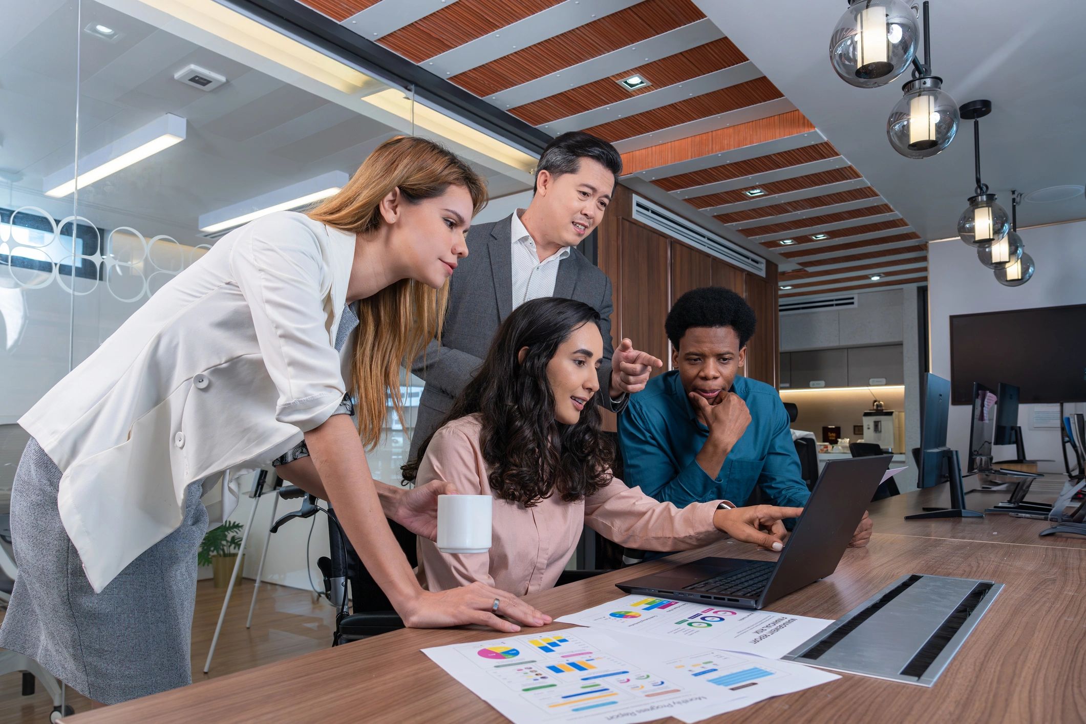 Colleagues collaborating in a modern office meeting room